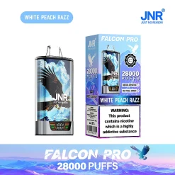 Embalaje al por mayor e imagen del dispositivo para el vapeador desechable JNR Falcon Pro 28000 Puffs en el sabor White Peach Razz. El dispositivo es de plata y cuenta con una pantalla inteligente, con el embalaje destacando el enorme recuento de 28.000 caladas, activación instantánea, y la actualización visual en negrita.
